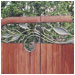 Mixing natural shapes with natural materials integrates this gate into the environment.