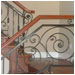 Wood and iron work together in this elegant stairway.