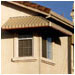 These complementary-colored awnings enrich construction details and protect interiors from solar heat in Fremont, CA.