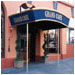 Fancy blue fabric and gold trim accents Grand Café's deco look.