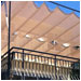 Roman shades soften this sunny deck.