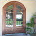 These copper-colored doors and window grace the entrance of this home.