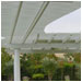 The lattice trellis follows the garden's curved path.