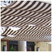 These striped drapes empart a casual air to this outdoor dining area.