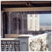  A clear drop curtain will block chill winds without blocking your view. It may be raised and lowered at will.