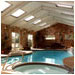 Using natural materials lends an outdoor flavor to this pool enclosure.